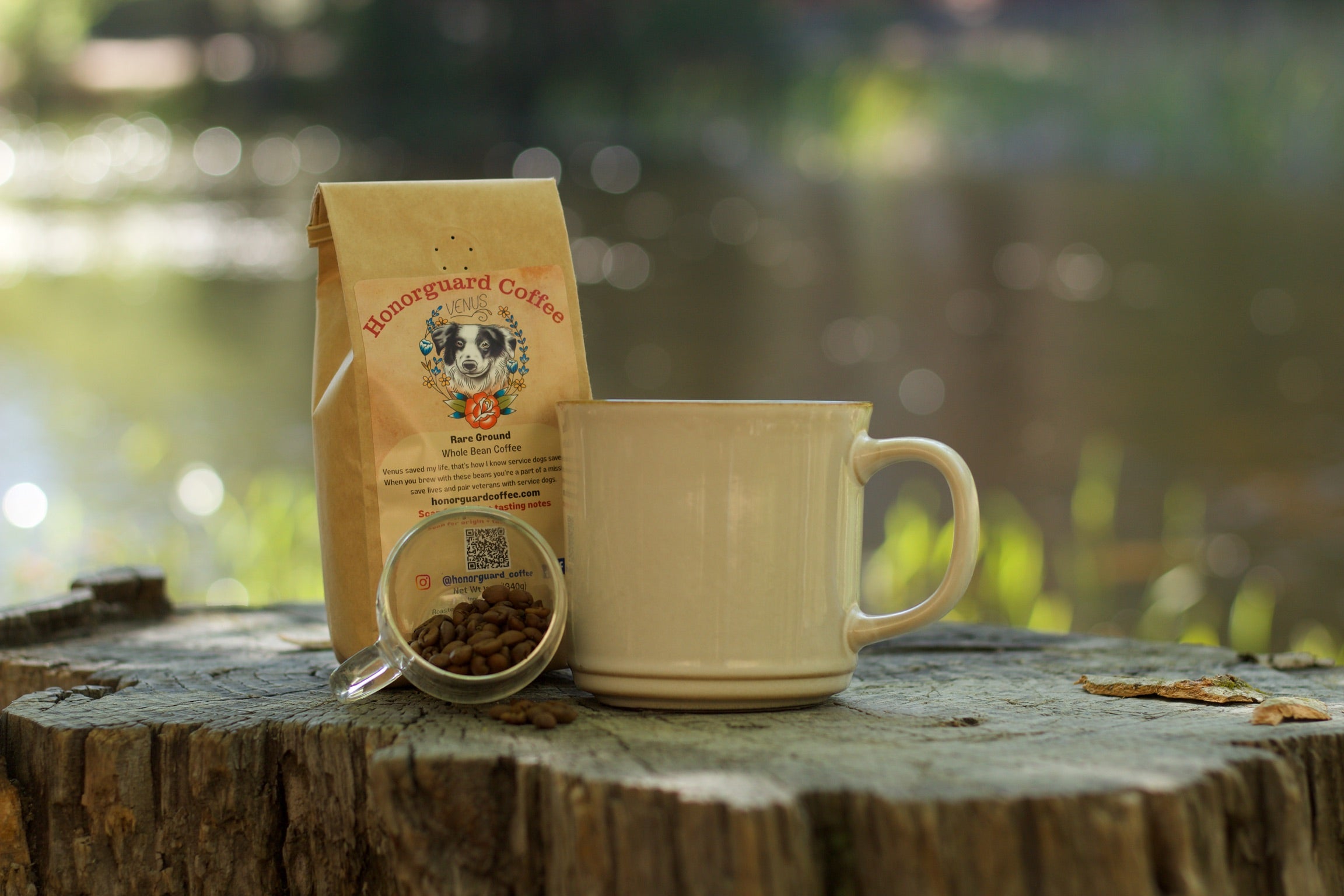 Roosterguard Coffee package with a mug on a wooden surface outdoors