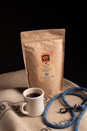 Light roast coffee single origin costa rican coffee beans specialty coffee fresh roasted in a mug filled with black coffee